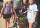 Hometown helpers community club plants flowers in Sylvan Grove