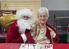Lincoln Park Manor residents received a special visit from Santa and one of his favorite elves at their Christmas par ty held December 20. Here, Donna Kingan visits with Santa. (Photo courtesy of Lincoln Park Manor)